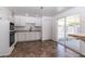 Updated kitchen features modern appliances, white cabinets, and convenient outdoor access at 1550 W Willow Ave, Phoenix, AZ 85029