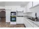 Bright kitchen with updated appliances, white cabinets and granite countertops at 1550 W Willow Ave, Phoenix, AZ 85029