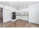 Well-lit kitchen with stainless steel oven, ample storage, and white cabinets at 1550 W Willow Ave, Phoenix, AZ 85029