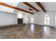 Spacious living room with wooden beams, tile floors, and fireplace, perfect for gatherings at 1550 W Willow Ave, Phoenix, AZ 85029