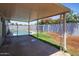 Covered patio overlooks a sparkling pool and landscaped yard at 1550 W Willow Ave, Phoenix, AZ 85029