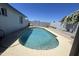 Backyard pool with clear water surrounded by a concrete patio and block fencing at 1550 W Willow Ave, Phoenix, AZ 85029
