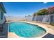 Backyard swimming pool with blue water, steps and gray block fence at 1550 W Willow Ave, Phoenix, AZ 85029