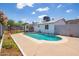 Sparkling backyard pool, surrounded by a concrete patio and lawn at 1550 W Willow Ave, Phoenix, AZ 85029