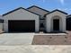 Charming single-story home featuring a well-maintained yard and a two-car garage at 15519 W Deanne Dr, Waddell, AZ 85355