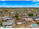 Neighborhood aerial view showcasing proximity to mature landscaping and mountain views in the distance at 1615 E Fremont Dr, Tempe, AZ 85282