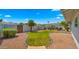 Landscaped backyard featuring a covered patio, privacy fence, and well-maintained lawn at 1615 E Fremont Dr, Tempe, AZ 85282