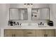 Bathroom vanity with double sinks, light wood cabinets, and quartz countertops at 1615 E Fremont Dr, Tempe, AZ 85282