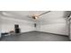 Spacious garage with painted floors, ample storage, and an automatic door opener at 1615 E Fremont Dr, Tempe, AZ 85282