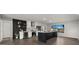 Bright kitchen with white cabinets, stainless steel appliances, a wine fridge and black accent wall at 1615 E Fremont Dr, Tempe, AZ 85282