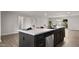 Large kitchen island with modern fixtures, stainless steel dishwasher, and seating perfect for entertaining at 1615 E Fremont Dr, Tempe, AZ 85282