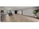 Spacious living room featuring sleek floors and an open layout with views to the kitchen at 1615 E Fremont Dr, Tempe, AZ 85282