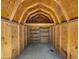 Interior view of a wooden shed with shelves, offering ample storage space at 1615 E Fremont Dr, Tempe, AZ 85282
