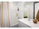 Pristine bathroom featuring a shower-tub combo and a well-lit vanity with ample counter space at 17383 W Fallen Leaf Ln, Surprise, AZ 85387