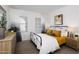 Bright bedroom featuring neutral tones, stylish furnishings, and serene decor for a relaxing retreat at 17383 W Fallen Leaf Ln, Surprise, AZ 85387