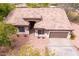 Bird's eye view of a home featuring a tile roof, desert landscaping, and a two-car garage at 18 E Paint Your Wagon Trl, Phoenix, AZ 85085
