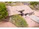 Aerial view of a single-story home with a well-maintained roof, desert landscaping, and a spacious driveway at 18 E Paint Your Wagon Trl, Phoenix, AZ 85085