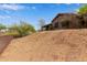 Backyard view showing the desert landscape and the patio of the home at 18 E Paint Your Wagon Trl, Phoenix, AZ 85085