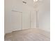Clean bedroom showcases sliding door closet, doorway to another room, and neutral carpet at 18 E Paint Your Wagon Trl, Phoenix, AZ 85085