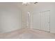 Carpeted bedroom boasts sliding door closet, open doorway to another room, and ceiling fan at 18 E Paint Your Wagon Trl, Phoenix, AZ 85085