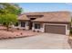Lovely single-story home boasting a meticulously maintained yard and a convenient two-car garage at 18 E Paint Your Wagon Trl, Phoenix, AZ 85085
