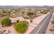 Aerial shot of a charming desert home with desert landscaping and tile roof at 18 E Paint Your Wagon Trl, Phoenix, AZ 85085