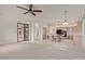 Open concept floorplan with the living room connected to a kitchen island and access to the patio at 18 E Paint Your Wagon Trl, Phoenix, AZ 85085