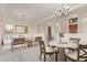 Open-concept living room featuring a cozy seating area and dining table, perfect for entertaining guests at 18 E Paint Your Wagon Trl, Phoenix, AZ 85085