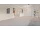 Expansive living room with neutral carpet and architectural columns at 18 E Paint Your Wagon Trl, Phoenix, AZ 85085