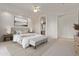 Serene primary bedroom with a plush bed, ensuite bathroom access, and neutral decor, ideal for relaxation at 18 E Paint Your Wagon Trl, Phoenix, AZ 85085