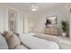 Spacious main bedroom with neutral decor, arched entryway to the bathroom, and ample closet space at 18 E Paint Your Wagon Trl, Phoenix, AZ 85085