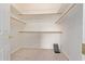 Spacious walk-in closet with ample shelving, rods and a secret floor compartment at 18 E Paint Your Wagon Trl, Phoenix, AZ 85085