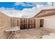 Enclosed backyard featuring a privacy wall and wood gate, offering seclusion and security at 1857 S El Marino Cir, Mesa, AZ 85202