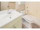 Bathroom with toilet, vanity, mirror, and shower/tub combination at 1857 S El Marino Cir, Mesa, AZ 85202