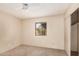 This bedroom features a ceiling fan, closet and window providing lots of natural light at 1857 S El Marino Cir, Mesa, AZ 85202