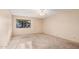 Neutral bedroom with large window and carpet at 1857 S El Marino Cir, Mesa, AZ 85202