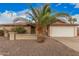 Charming single-story brick home featuring a two-car garage and a desert landscaped front yard at 1857 S El Marino Cir, Mesa, AZ 85202