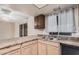Features include wood cabinets, laminate counters, and a stainless steel sink at 1857 S El Marino Cir, Mesa, AZ 85202
