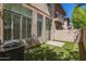Exterior view of the backyard and patio with lush artificial turf, ideal for outdoor living at 2019 E Campbell Ave # 110, Phoenix, AZ 85016
