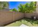 Private backyard featuring artificial turf and a block wall, perfect for outdoor relaxation and activities at 2019 E Campbell Ave # 110, Phoenix, AZ 85016