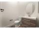 Stylish half-bath with modern vanity, sink, oval mirror and updated fixtures at 2019 E Campbell Ave # 110, Phoenix, AZ 85016