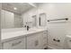 A simple bathroom with a glass shower, clean toilet, and a vanity mirror with under-sink storage at 2019 E Campbell Ave # 110, Phoenix, AZ 85016