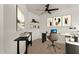 Stylized, bright bedroom with a ceiling fan and desk area ready to be used as a home office at 2019 E Campbell Ave # 110, Phoenix, AZ 85016