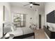 Stylized bedroom with ceiling fan, carpet floors, closet, sliding door access, and a chair at 2019 E Campbell Ave # 110, Phoenix, AZ 85016