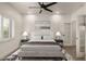 A modernized and decorated bedroom with a ceiling fan, carpet floor, and furniture at 2019 E Campbell Ave # 110, Phoenix, AZ 85016