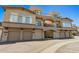 Beautiful condo building exterior showing multi-level patios and attached garages at 2019 E Campbell Ave # 110, Phoenix, AZ 85016