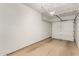 Garage interior with concrete floor and overhead storage, providing ample space for parking and storage at 2019 E Campbell Ave # 110, Phoenix, AZ 85016