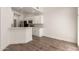 Bright kitchen with white cabinets, stainless steel appliances, and breakfast bar at 2019 E Campbell Ave # 110, Phoenix, AZ 85016