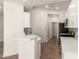 White cabinets, stainless appliances and breakfast bar featured in updated kitchen at 2019 E Campbell Ave # 110, Phoenix, AZ 85016