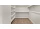 Walk-in closet with built-in shelving, providing ample storage space for clothes and accessories at 2019 E Campbell Ave # 110, Phoenix, AZ 85016